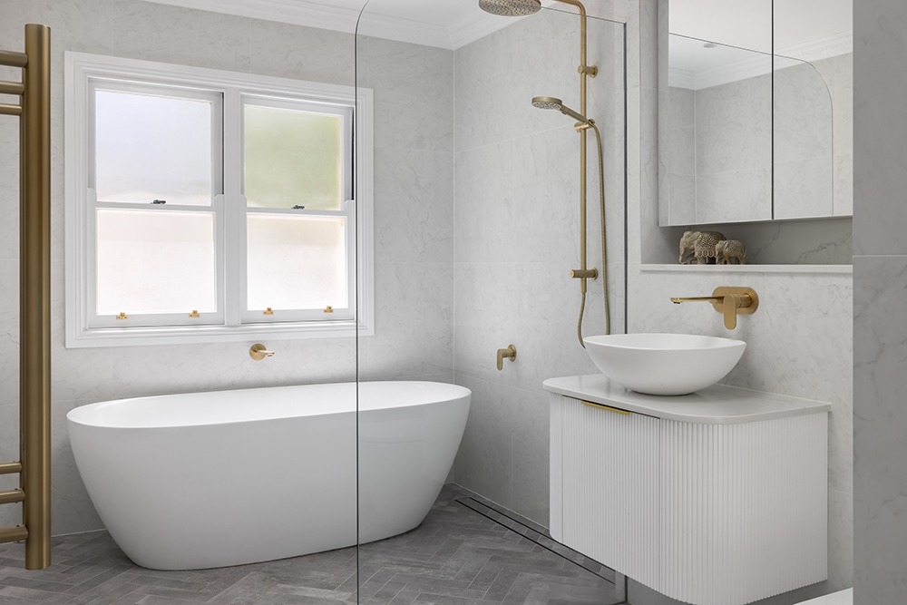Bellevue Hill bathroom featuring herringbone floor tiles and Bianco Carrara wall tiles