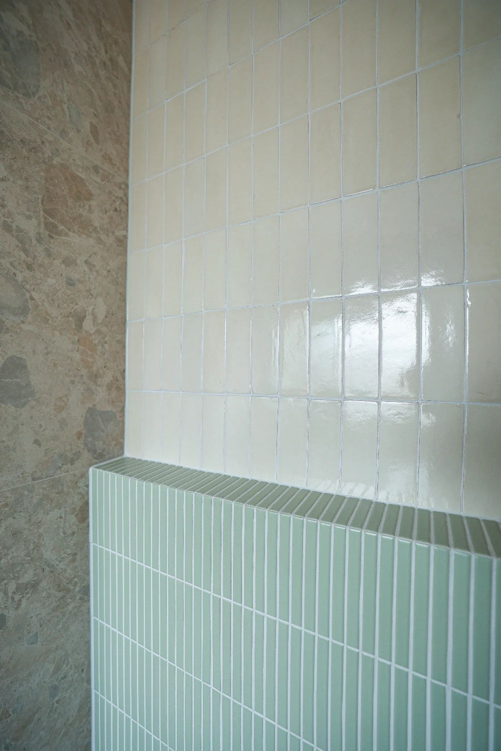 Zellige Natural meeting Norrock Ivory — handmade glaze against rectified porcelain.