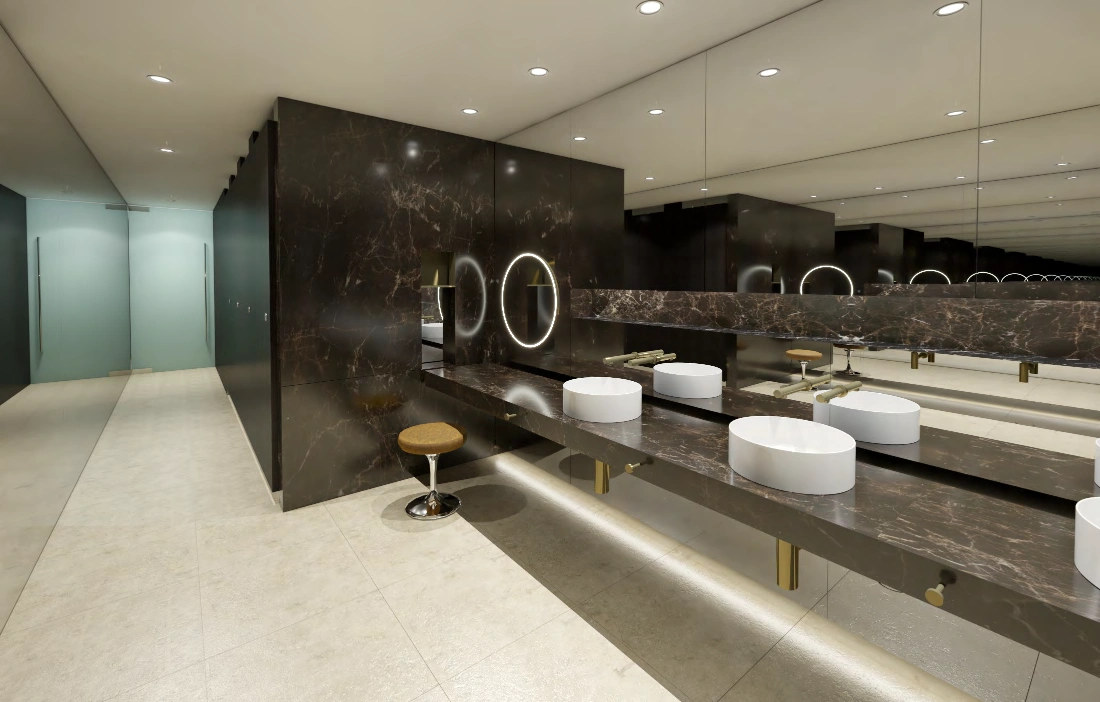 Female amenities, alternate view — feature vanity, brass tapware and concealed lighting.
